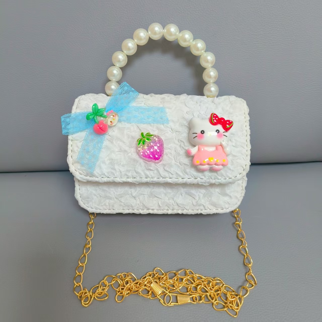 Bow Pearl Princess Handbag Meileti Kulomi Girl Año Nuevo Cartera pequeña bolsa de cadena de viento fragante
