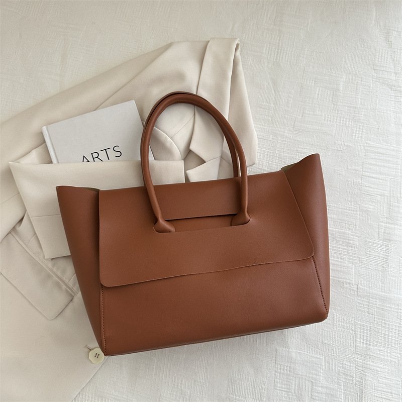 Nuevo diseño de color sólido portátil de un solo hombro fresco 2024 temperamento de otoño e invierno axilas retro de gran capacidad bolso Tott