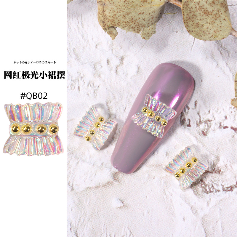 Accesorios de falda de arte de uñas 2021 nueva celebridad de Internet pequeño libro rojo estilo caliente hada aurora falda plisada decoración de uñas