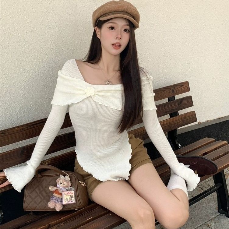 フランス風の気質の木の耳元の立体的な花の一字の肩のニットの上着の修身のセーターの底のシャツの女性は秋冬を掛けます。