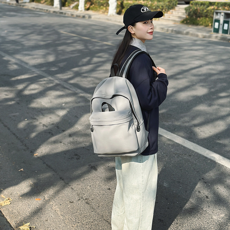 Las chicas japonesas de bolsos de lona son antiguas, impermeables, de color sólido, bolsos de nylon, Campus simple y versátil mochilas escolares para hombres de moda.