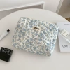 Hand in a makeup bag