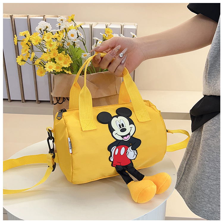 The 2021 new children's bags feature a cute Mickey Mouse pattern bowling bag for girls and a fashionable hand-held shoulder bag undefined