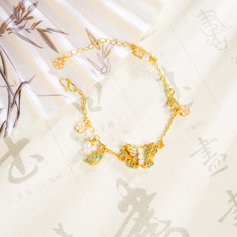 Nuevos productos multicapa mariposa alta sensación de perla de cerezo esmalte color esmaltado pulsera mariposa vida mujer accesorios versátiles suministro