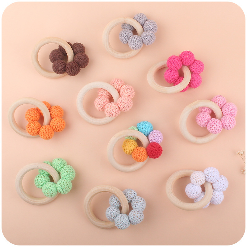 Nuevo bebé suministros Hemu teether pulsera bebé cuentas de lana flor juguete dientes molienda palo AliExpress