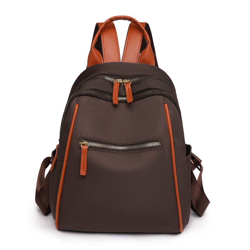 Mochila portátil para mujer 2024 nuevo estilo nylon fuera de viaje mochila simple bolsa de escuela de estudiante de gran capacidad al por mayor