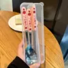 Strawberry, spoon, fork, chopsticks, box