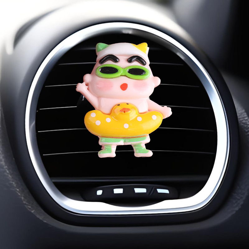 Vehículo de ventilación pequeña cabeza grande pequeña nueva fragancia perfumes de automóviles dibujos animados adornos artículos de decoración artículos de automóviles