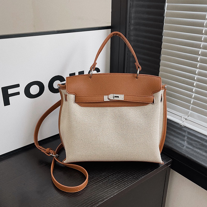 Bolsa de mano transfronteriza para mujeres 2026 nueva tela de lino empalmada color de textura de viaje mochila de hombro