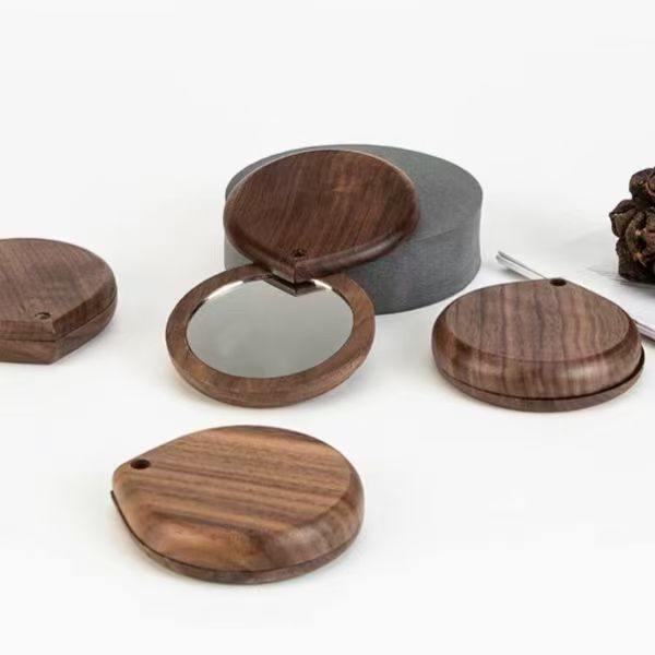 Ventas transfronterizas de nueces negras de alta definición de maquillaje de mano espejo de doble cara espejo de maquillaje de madera giratorio espejo de bolsillo portátil