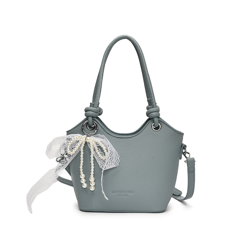 Bolso de cubo popular de este año para mujer 2025 nuevo bolso de mensajero de nicho de alta gama bolso de hombro de viajero súper caliente