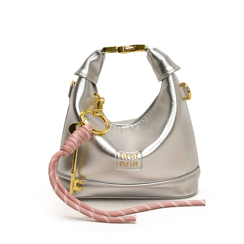 Bolso de hombro para niña coreana bolso de bebé con bloqueo de cuero de aceite de color sólido simple 2025 nuevo mini bolso para niños