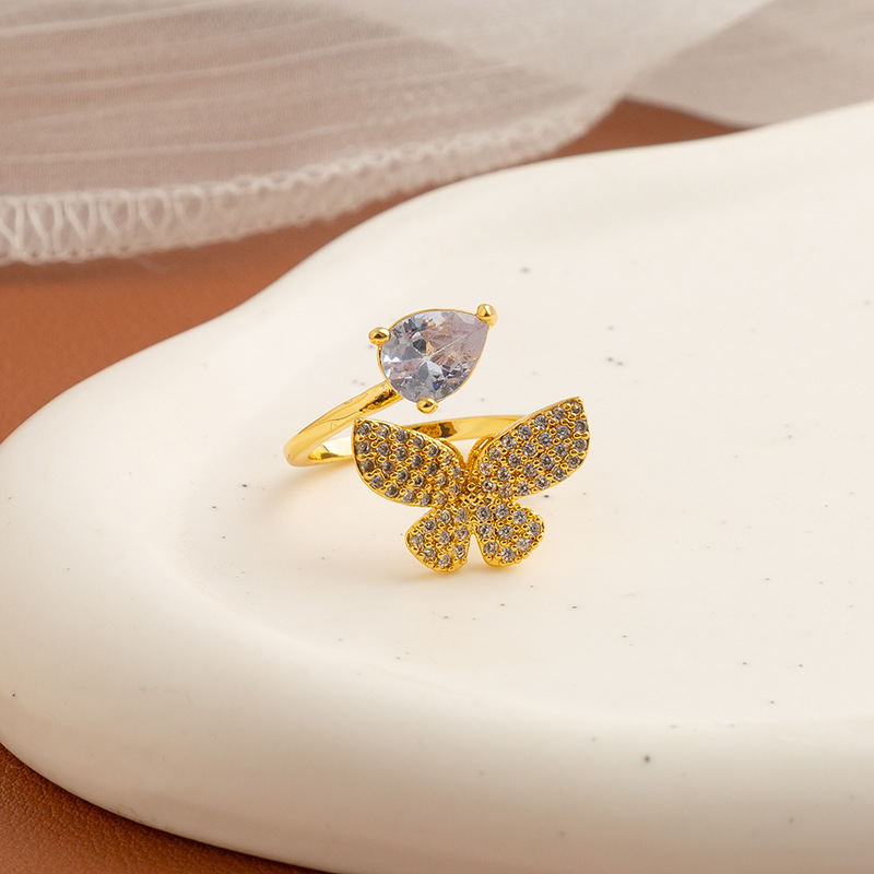 Golden ring with stone with zircon