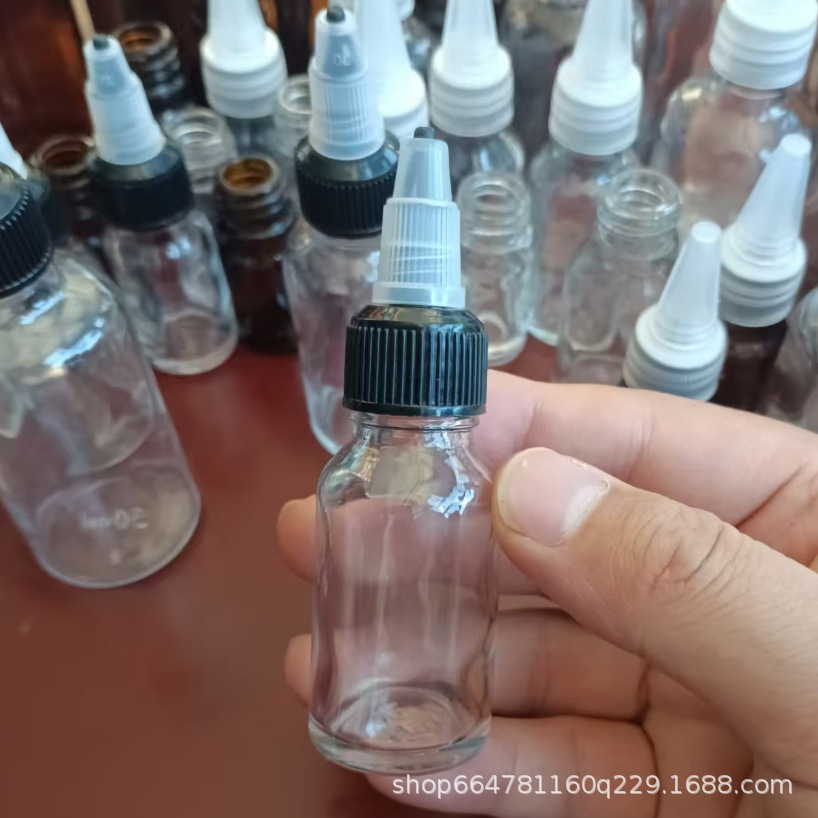 Botella de punta de vidrio Botella de aceite esencial Botella de esencia Botella de agua Botella de solución bruta Botella vacía Botella de goteo de punta rotativa Botella sellada
