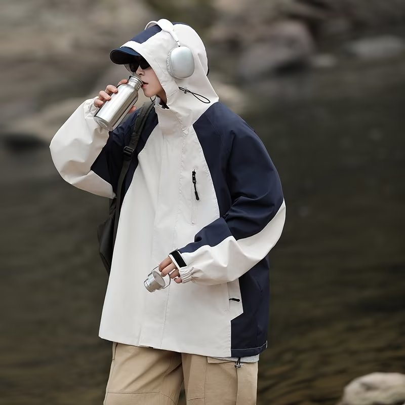 "Wasserabweisende Arbeitsjacke mit Kapuze für Herren – Leichter, stoßfester Bergmantel für Outdoor- und Freizeitkleidung (Bläulich/Schwarz, M-3XL)"_voghion.com
