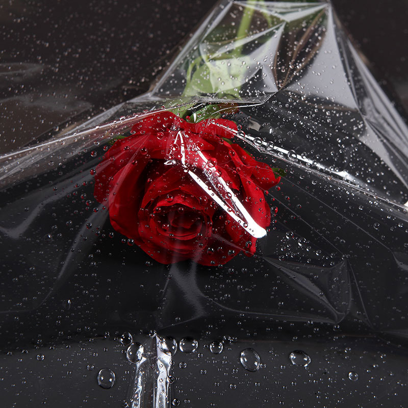 Celofán transparente plástico flor papel de embalaje ramo base hecha a mano rollo transparente flor tienda floral material en stock al por mayor