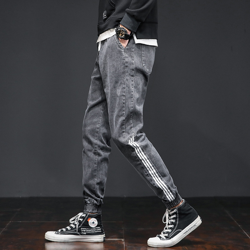 Jeans casuales de cintura elástica sueltos para hombres primavera de moda coreana para hombres, nueve puntos.