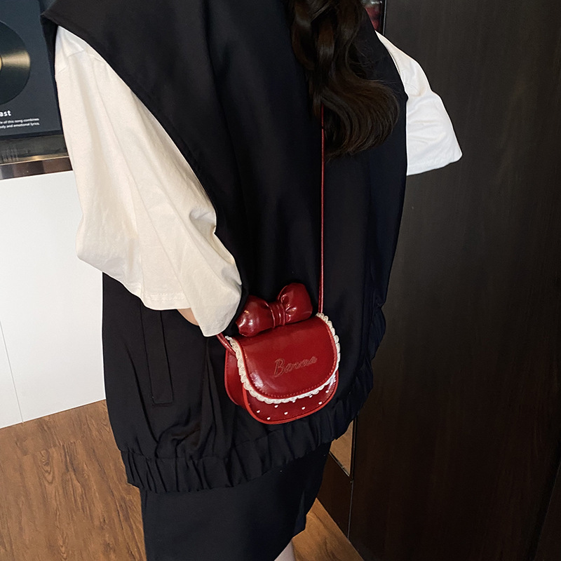 Nuevos accesorios para niños dulces lindos bolsos de hombro princesa arco ondulado punto de micro bolso de bebé