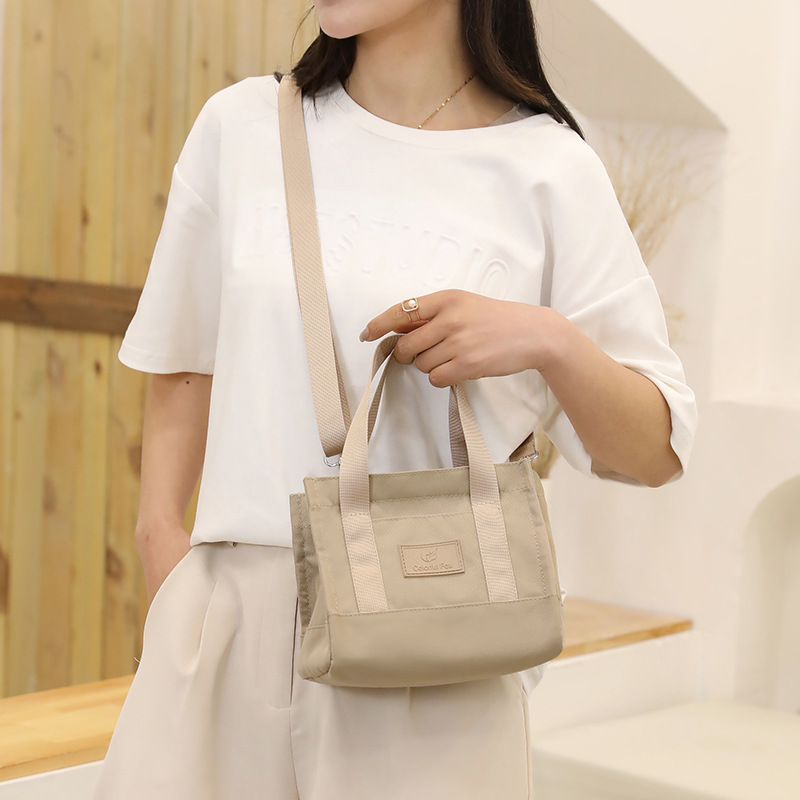 Bolsos de mujer de nylon impermeables transfronterizos, bolsos de moda y sencillos, bolsos de personalidad, compras ligeras, bolsos de hombro único portátiles