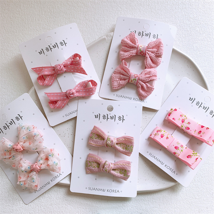 Korean-style children's pink fabric butterfly clip hair accessories for girls, sweet hair clips with side bangs and fringe, pair of hairpins