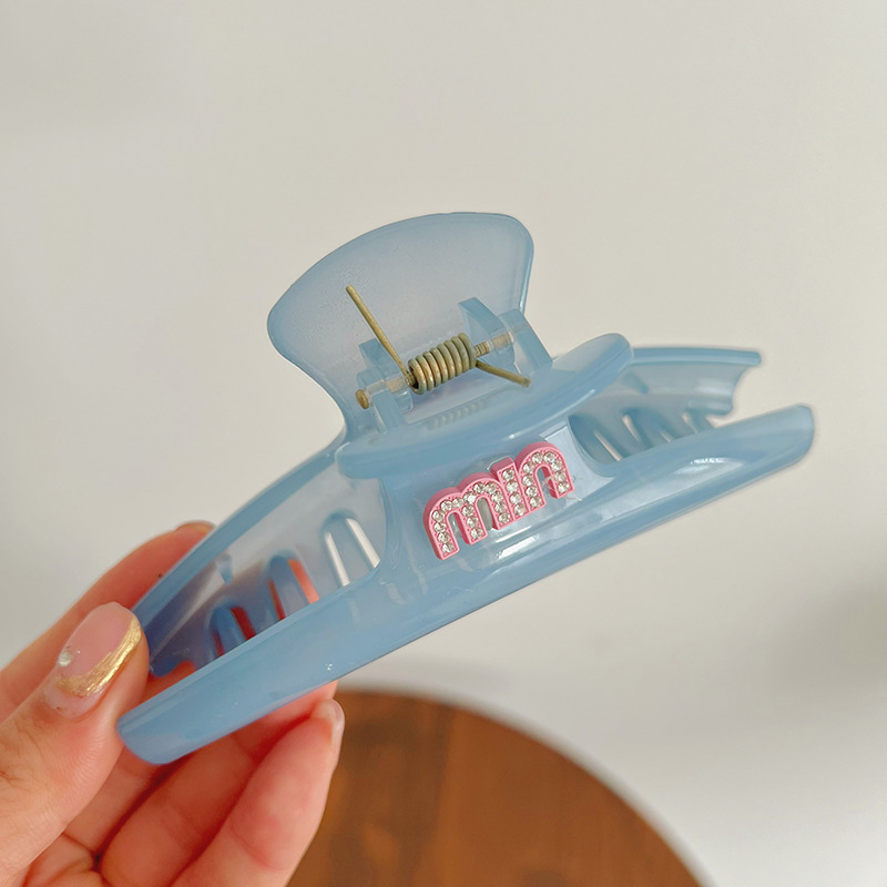 Blue crooked crab pin with letters
