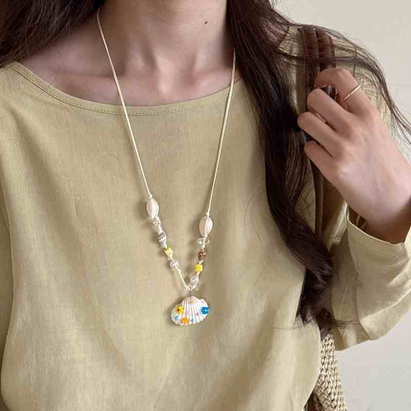 Cuerda de cera estrella de mar concha colgante de perlas collar vacaciones de verano estilo cadena de clavícula cadena de suéter de moda fresca y dulce mujer