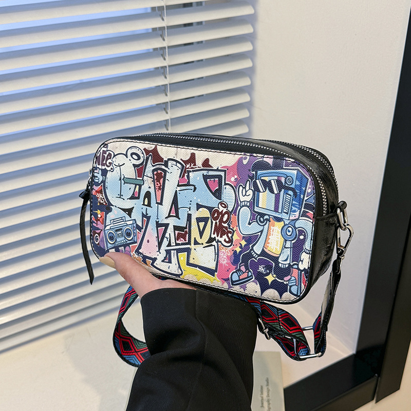 Bolso cuadrado pequeño estilo explosivo transfronterizo, graffiti de personalidad femenina, bolso puenting, bolso de cámara con correa de hombro ancha de moda, bolso de mensajero de hombro de todo fósforo