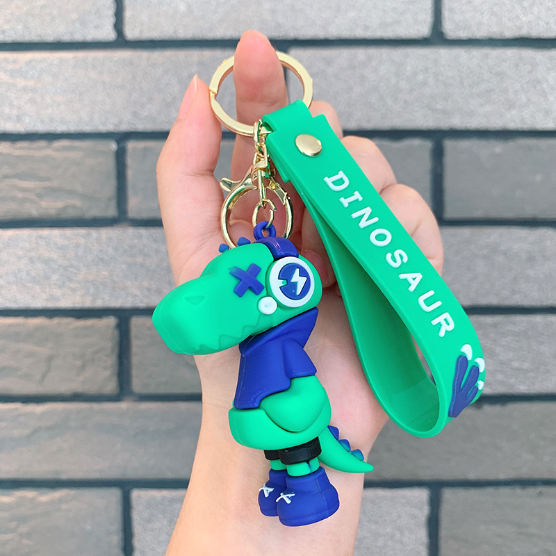 Dinosauro llavero música rayo pequeño dinosaurio muñeca de silicona bolso llavero de automóvil colgante moda regalos frescos