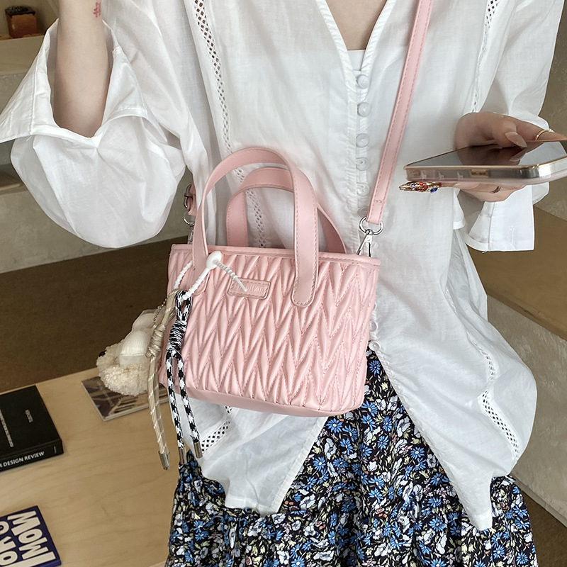 Coreano simple bolso de mano plegable de color sólido bordado de estilo extranjero bolso de hombro para hombres y mujeres nuevos accesorios para niños transfronterizos