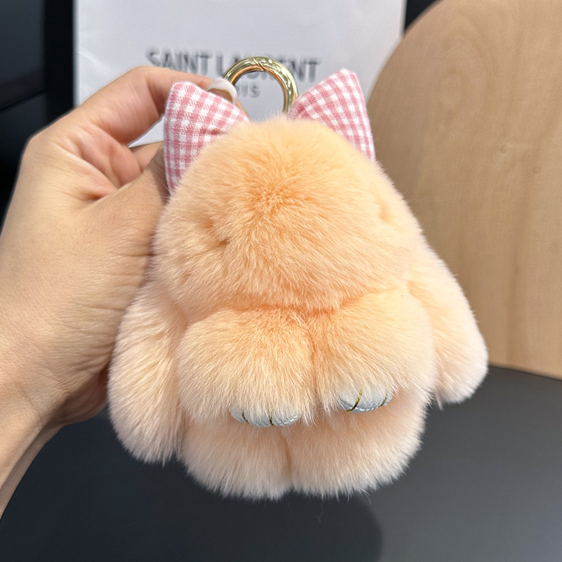 卸売りのかわいいウサギの毛の蝶結びの小さいウサギの自動車のキーホルダーはぬいぐるみのかばんを掛けて飾ります。