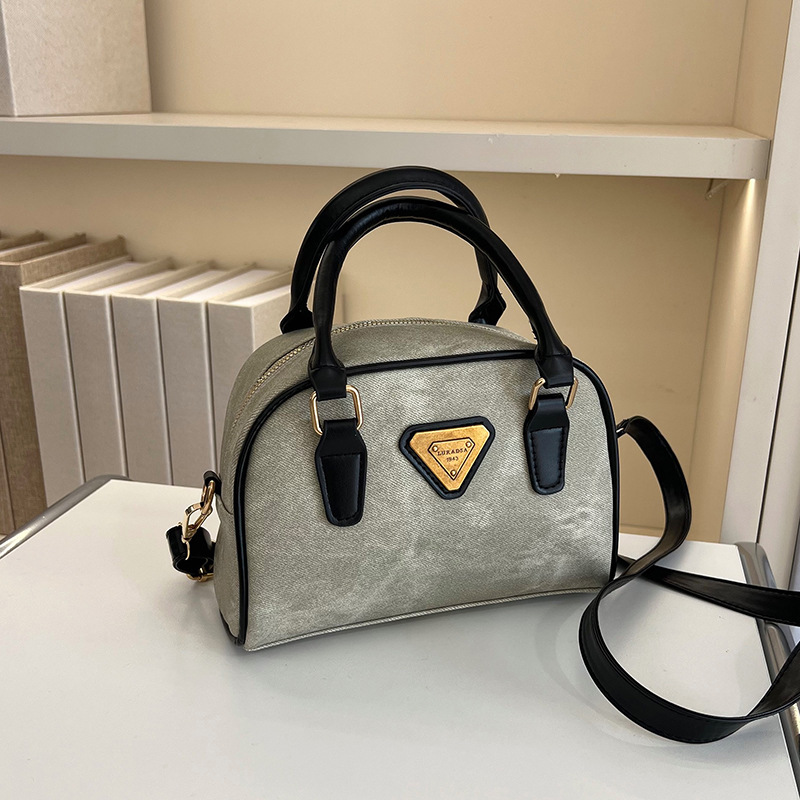 Color retro bolso mujer 2025 primavera y verano nuevo bolso de almohada de mano textura de moda personalidad mochila de viaje