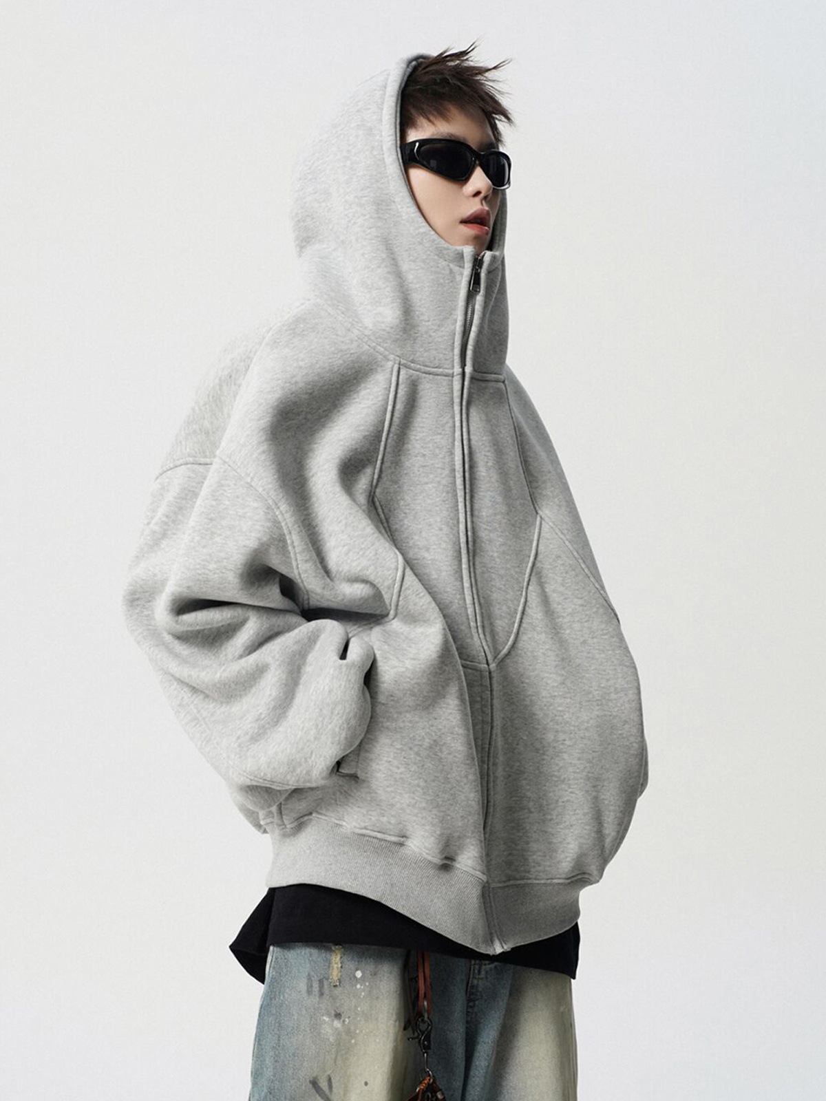 アメリカの重ポンドは帽子付きのコートを作ります。