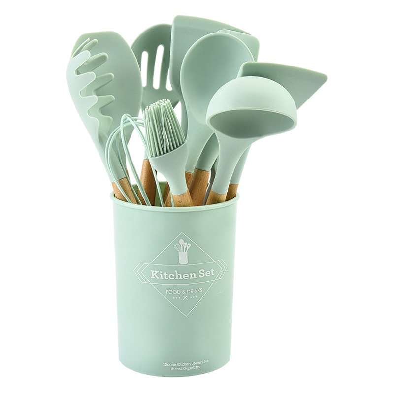 Traje de utensilios de cocina de silicona transfronteriza mango de madera sartén antiadherente de 12 piezas pala de cocina cuchara suministros de cocina espátula de silicona conjunto completo