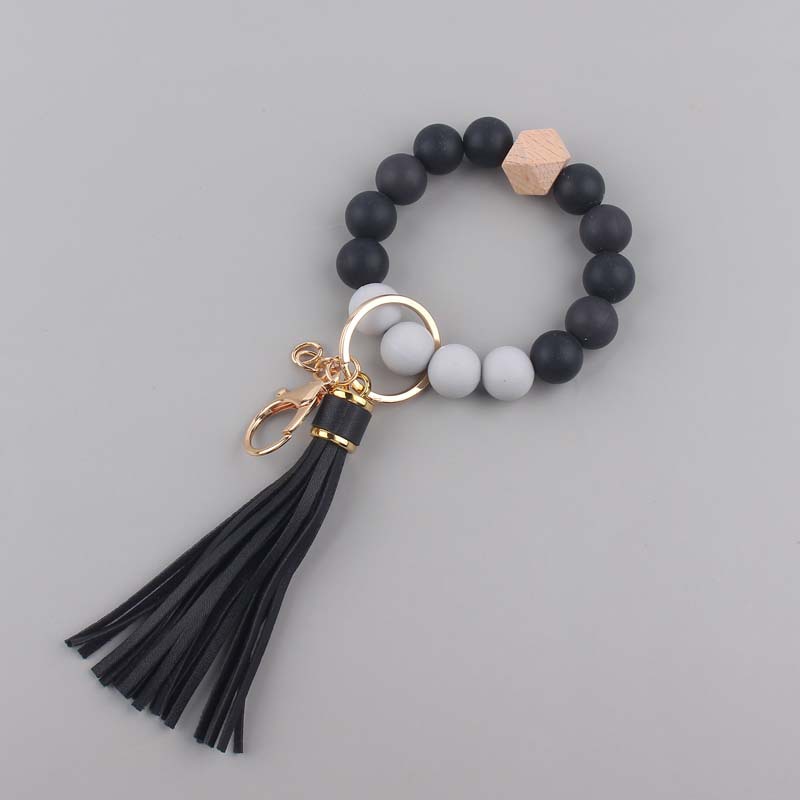Nuevo cuero creativo pu borla colgante silicona muñeca llavero colgante silicona cuentas pulsera llavero