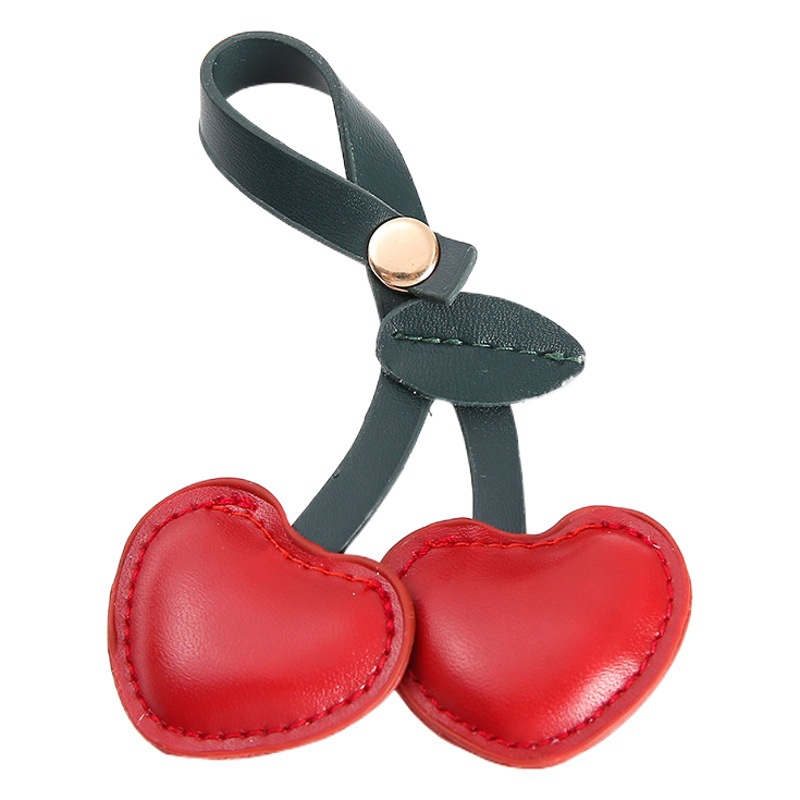 Productos de celebridades de Internet de estilo pastoral europeo y americano Colgante de llavero de cereza de cuero Colgante de bolso de llavero