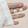 Mosquito coil with zircon with bow pearl, ear clips
