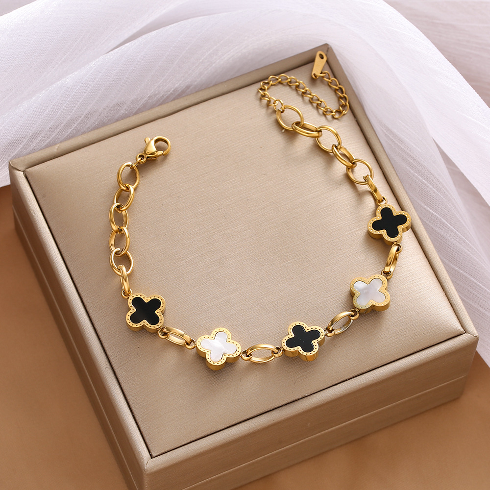 Pulsera de trébol de acero titanium vendedora caliente transfronteriza europea y americana con incrustaciones de concha pulsera colgante pulsera de diseño avanzado sin desvanecimiento al por mayor