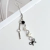 Kitten fish bone pendant