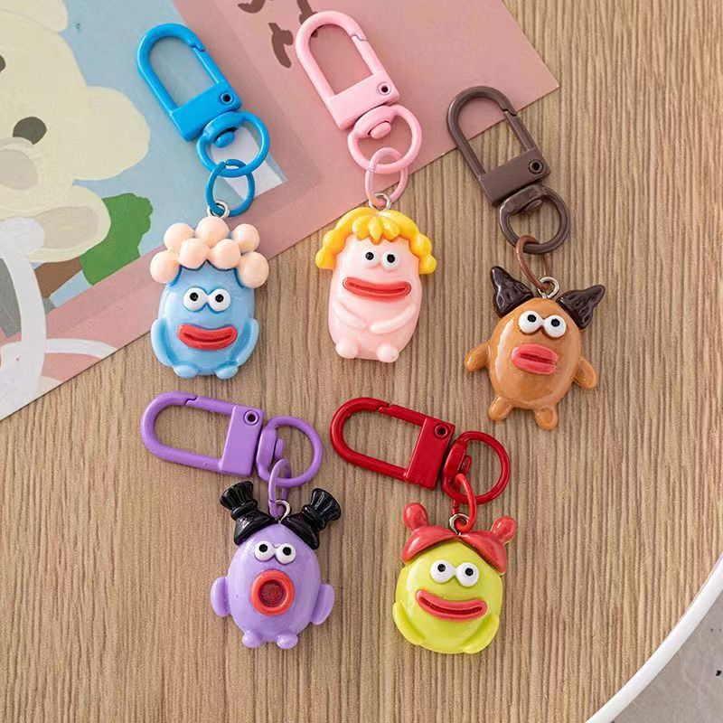 Bonita boca grande extraña llavero salchicha colgante estudiante pequeño libro rojo con accesorios colgante de color para amigos regalos