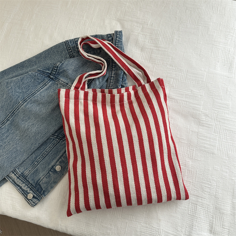 Bolsa de lona a rayas coreana simple bolso de hombro de estudiantes de literatura y arte gran capacidad de lazo bolso de mano