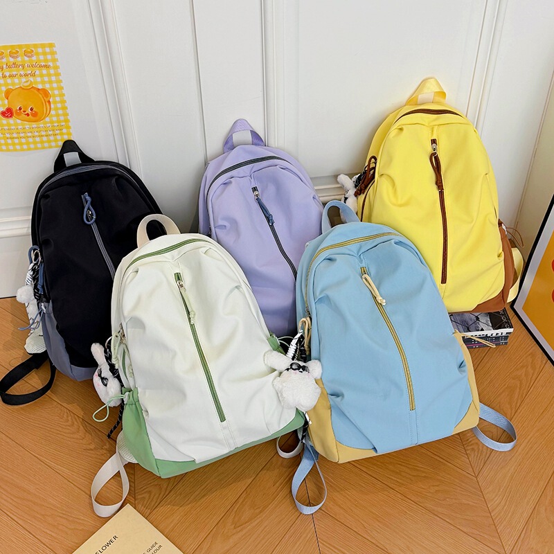 New large-capacity backpack, simple design, unisex, water-resistant, suitable for casual commuting and travel, wholesale