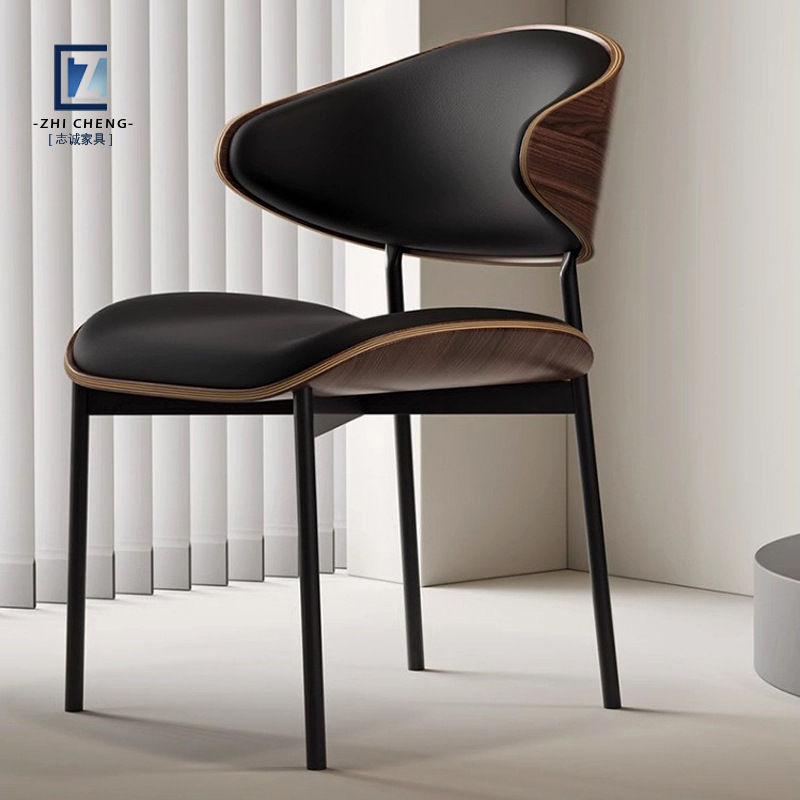 Italian light luxury minimalist designer dining chair, home use with a high-end black backrest, Nordic high-end modern study chair