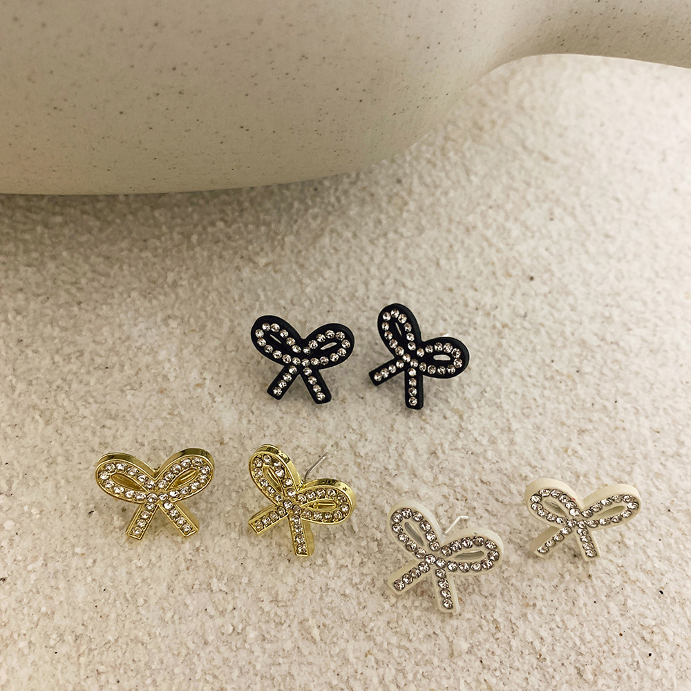 1 Pair Fashion Bow Knot Plastic Resin Inlay Artificial Diamond Women's Ear Studs display picture 1