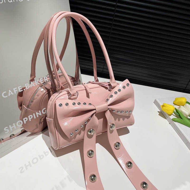 Bolso de axila de textura de alta calidad 2025 verano nuevo bolso femenino lindo lazo bolso de hombro con remache personalizado