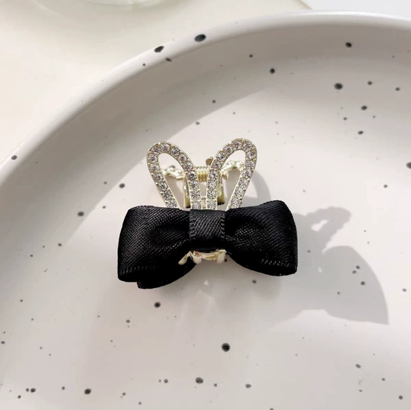 Black rabbit with bow