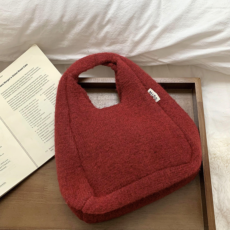 Bolso de hombro 2025 nuevo otoño e invierno nuevo estilo coreano simple y versátil bolso de muñeca de punto de gran capacidad bolso