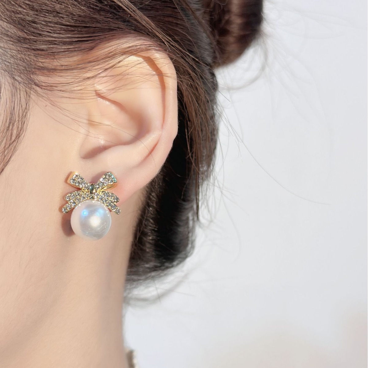 Korean bow pearl studded diamond temperament, niche, light luxury, high-end design, earring earrings_voghion.com