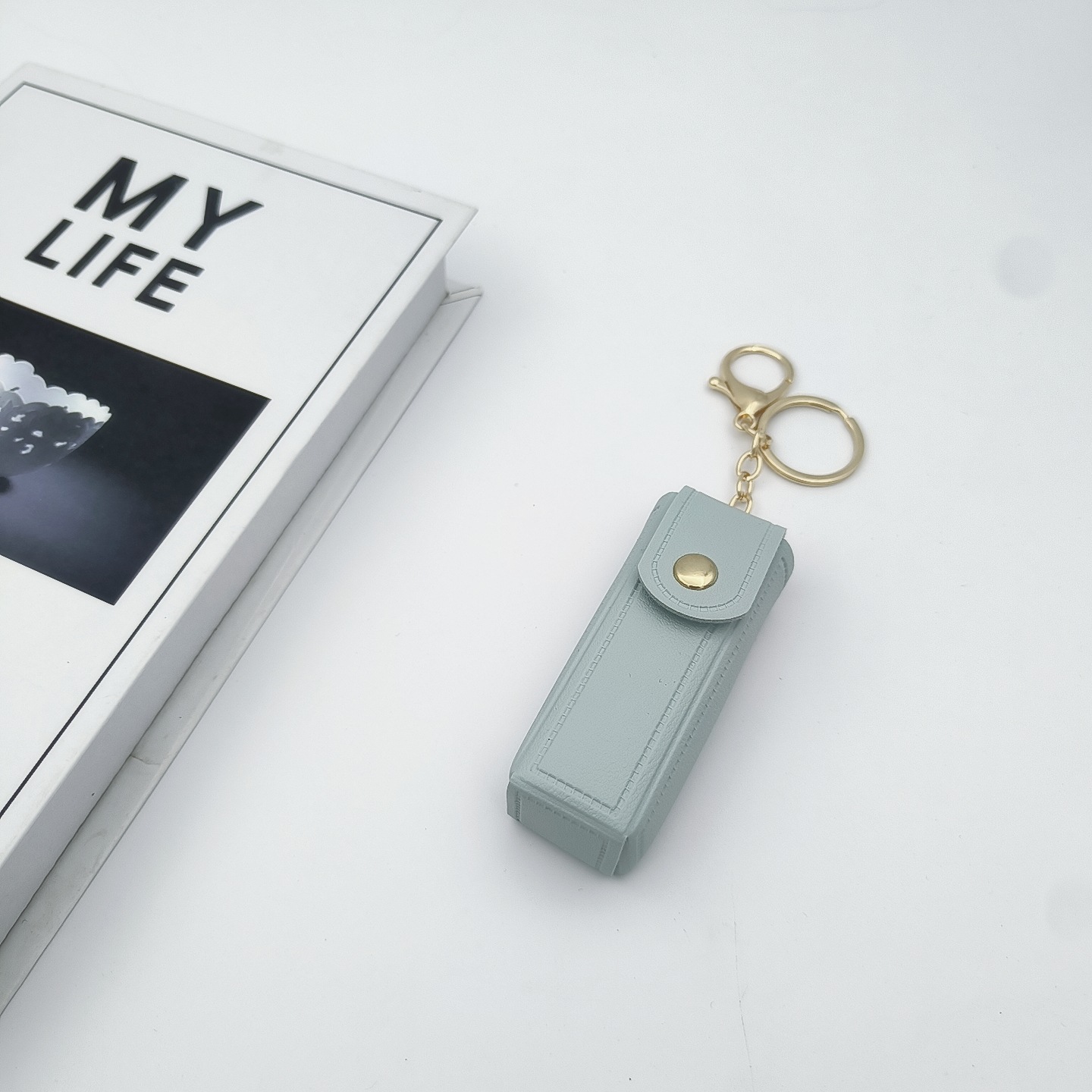 Bolso de cambio transfronterizo sobre rojo espejo creativo llavero colgante pequeño PU cuero bolso de coche accesorios accesorios en stock