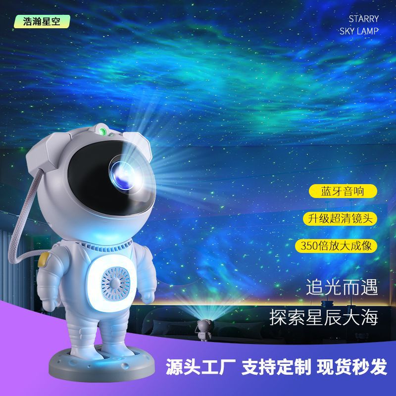 Nueva luz de proyección de cielo estrellado Bluetooth transfronteriza, colorida atmósfera de astronauta de carreras de caballos, luz nocturna, adornos de astronauta RGB
