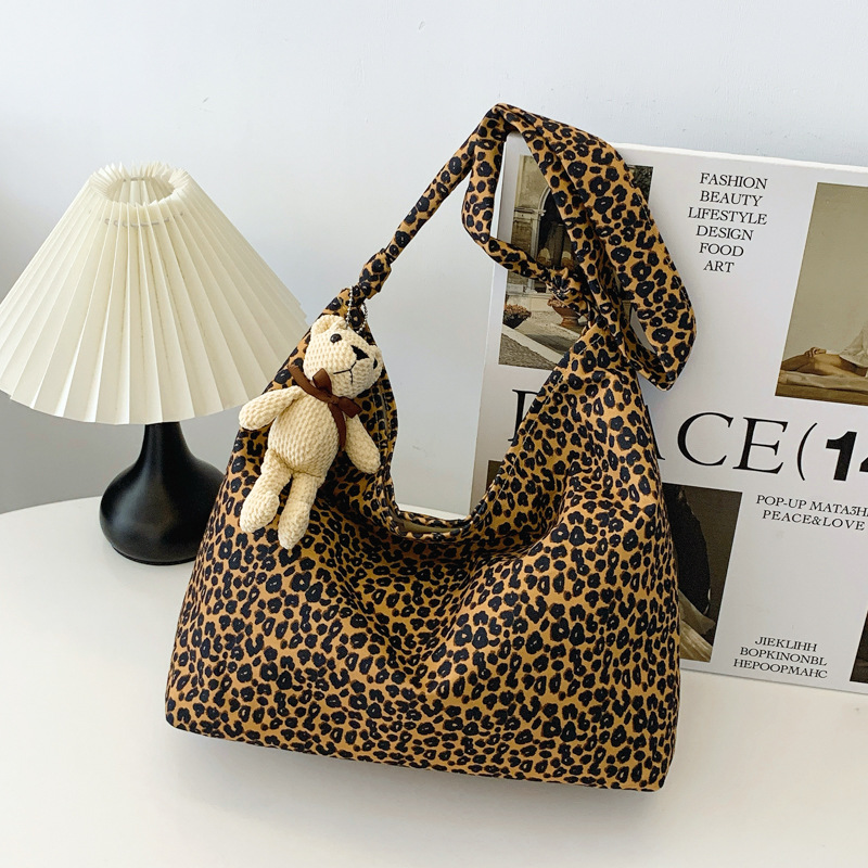 Estudiantes universitarios clase de viaje bolsa de gran capacidad para mujeres 2024 nueva moda extranjera leopardo tela mochila